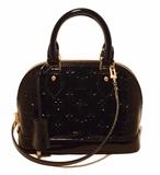 STUNNING LOUIS VUITTON alma bb in NWOT excellent condition. Black magnetique monogram vernis leather exterior trimmed with gold hardware. Full double zipper closure opens to a black canvas interior that holds just the right amount of space for your essentials. Removable matching vernis shoulder strap easily converts this style from hand to shoulder bag to suit your tastes. Excellent condition. No stains, smells or scuffs. Clean corners, edges, and interior. Absolutely stunning classic design perfect for day or night. Purchase includes dust cover and clochette with 2 keys and lock.
Measurements: 9.5"x6.4"x4.5" 3.5" handle drop 21"strap drop

Free shipping for this item within the continental US.