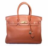 GORGEOUS AUTHENTIC HERMES tan 35cm clemence leather birkin bag in excellent condition. Tan clemence leather exterior trimmed with shining gold hardware. Signature double strap twist closure opens to a tan kidskin lined interior that holds 1 zippered and 1 slit side pockets. This piece is in excellent condition. No stains, smells, or scuffs. Clean corners, edges, and interior. The Hermes Birkin bag is one of the most coveted fashion accessories of all time. From the 1960s through today, this versatile bag is perfect for work or play and will undoubtedly stand the test of time in classic Hermes style. 
Purchase includes a dust cover, clochette and keys
Measurements: 13.5"x9"x7" 4" handle drop

Free shipping for this item within the continental US.