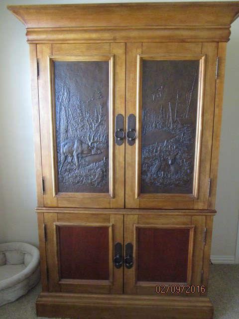DICK IDOL MONTANA RUSTIC ARMOIRE.  BEAUTIFUL DESIGN ON  TOP DOORS.  REMOVABLE TV PLATFORM WILL ACCOMODATE 32" TV. 