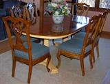 Gorgeous Dining room table with two leafs and six chairs. China cabinet to match