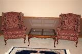 Red wing back chairs. Glass coffee table