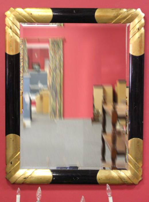 Large decorator mirror in black and gold.