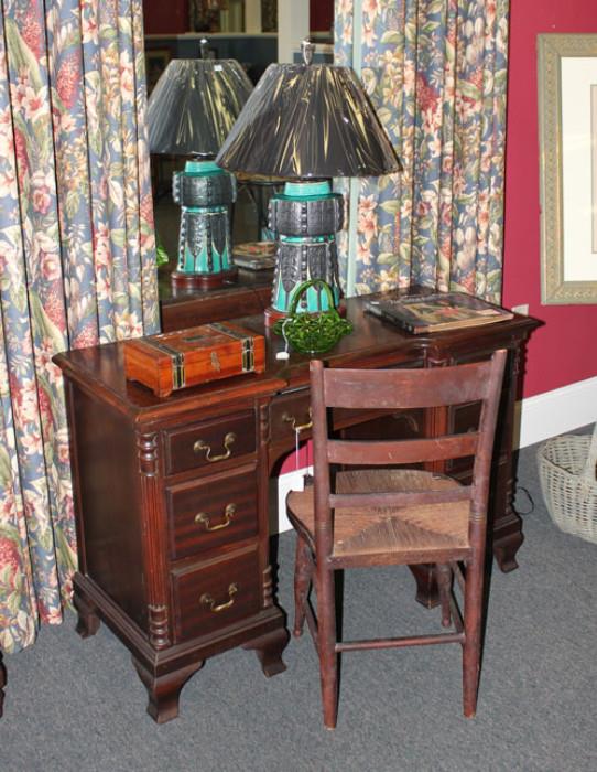 Dark wood desk and Lamp.