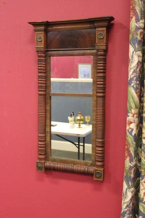 Here is a 19th Century style mirror. Half-turnings and walnut veneer are in its construction.