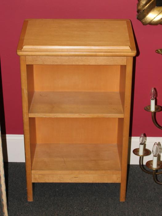 This blond colored wooden lectern is in very good condition.