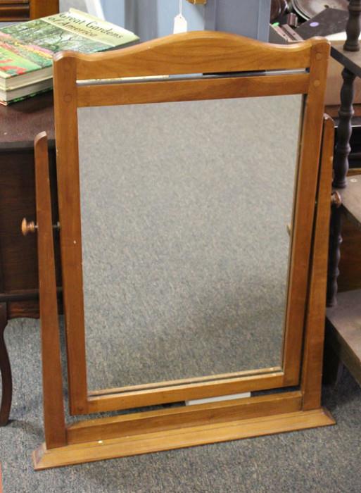 This simple maple framed mirror is in good shape.