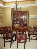 Cherry dining table and chairs with a matching china cabinet