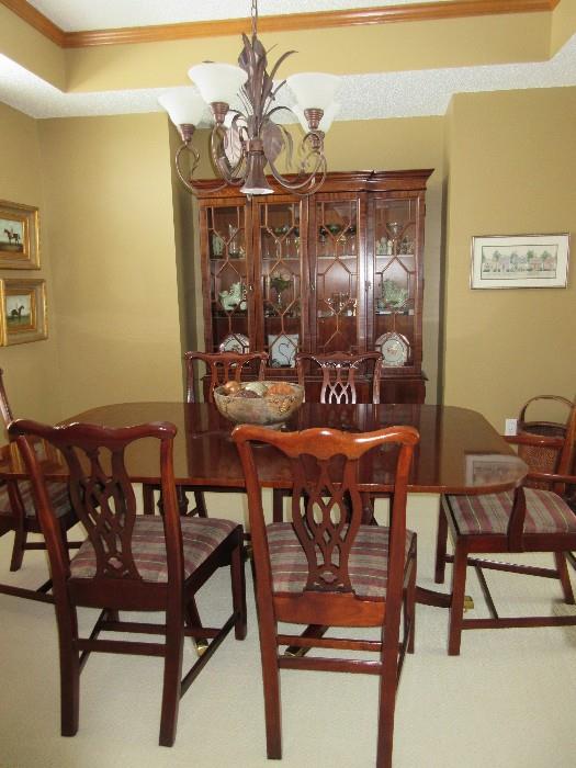Cherry dining table and chairs with a matching china cabinet