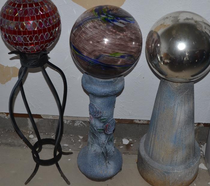 Gazing balls (not all pictured) and stands, variety