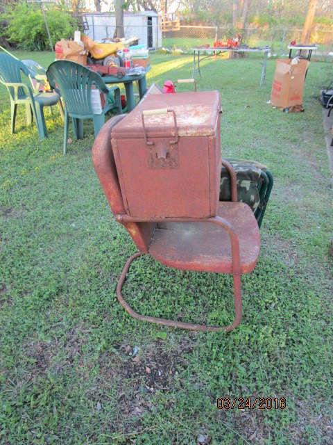 SIDE VIEW OF COCA COLA BOX ON LAWN CHAIR