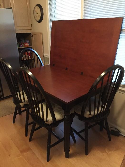 Table swivels around and will open to accommodate 8.