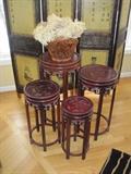 Rosewood nesting tables with sterling silver inlays.