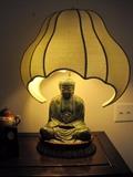 Vintage Bronze Buddha lamp on stand.
