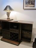 Teak server/cabinet. Brass elephant lamp.