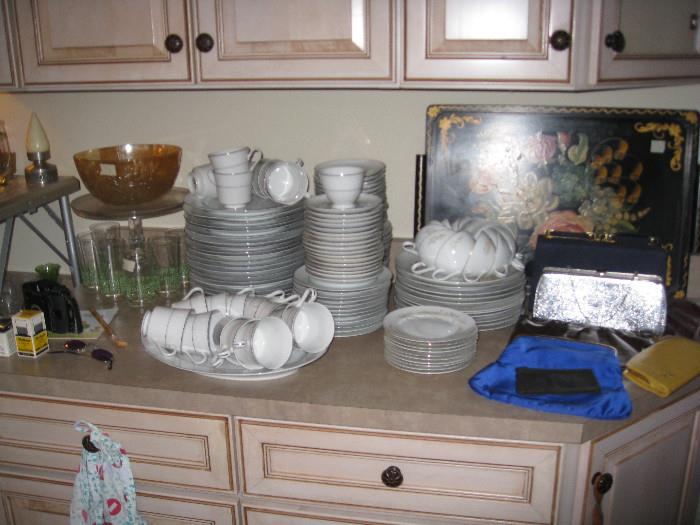 Large tray in background, dish sets, vintage purses