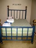 Full metal bed with Paul Bunyan brass knobs