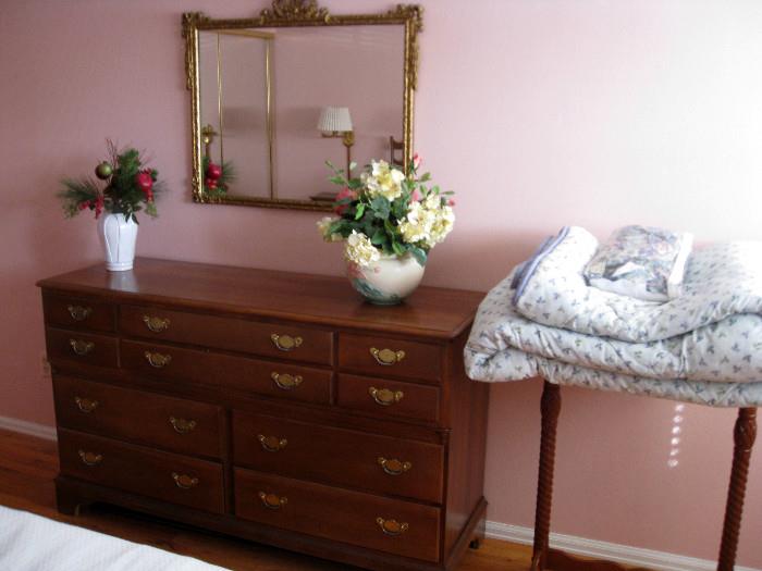 Wood dresser, ornate mirror, King spread with 2 pillow shams