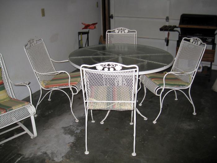 Metal patio chairs and glass top table