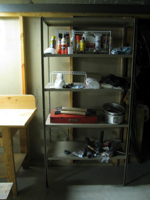 Shelf with some tools, covered pan etc