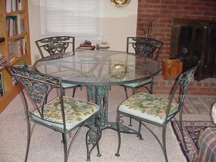Wrought iron pedestal table and chairs, rose motif