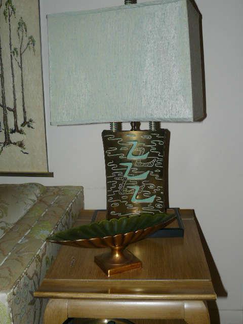 cast brass lamp is unusual and shades are in perfect condition!
