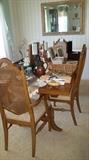 Thimasville dining room table with 3 extra leaves and 4 chairs.
