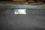 Label to upholstered chair (one of two)