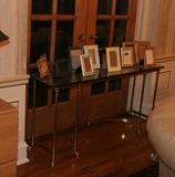 glass top table with picture frames