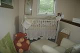 Crib with mattress and bedding.