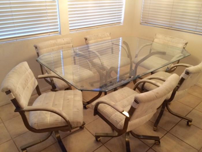 beveled glass dining room table w/ 6 chairs on castors