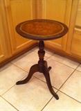 leather-top pedestal accent table