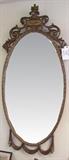 C/1930's French style Gilt Entryway mirror w/scroll and drapery, 58" h. 