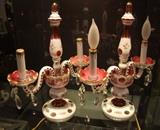 Pair of C/1920's Bohemian white cut to cranberry mantle lamps (2 arm) w/crystal drops, h.p. flowers and gilt trim 