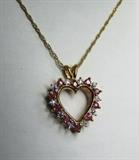 Ladies 10k Yellow Gold Heart pendant w/Rubies and Diamonds on a 14k Yellow Gold Twisted Rope chain 