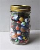 Pint jar of vintage marbles including lg. ones 