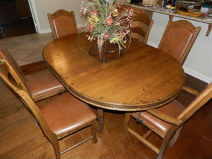 High End Solid Wood/Iron Dining Table - Stunning!        This has a 20" leaf that butterflies and stores in table.    The quality of this table is amazing!  