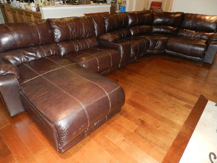 Brown Leather Sectional Sofa - 2 reclining units, drink/compartment unit and chaise.  Very nice and very comfy!  