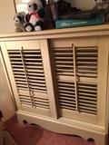 Shutter type cabinet, 2 sliding doors,  2 shelves  approximate size   29 inch high,  28 inch long,  17 inch depth