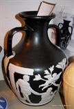 Rare Wedgwood Draped Portland Vase featured recently on Antiques Roadshow given an insurance value of 3 to 5000 , this is a true Collector Piece. This piece was made in 1839 identified by the seam down both sides under handles, Men draped, cupid with right leg protecting .....this verified in the Wedgwood Rarities book by Harry Buten from the Wedgwood Museum.
