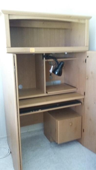 Very well taken care of Pine computer cabinet. Doors open and close easily.
