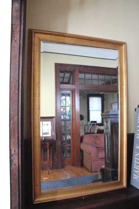 Giant Uttermost Beveled Mirror with muted gold frame. measurements are 69"T 45"W 