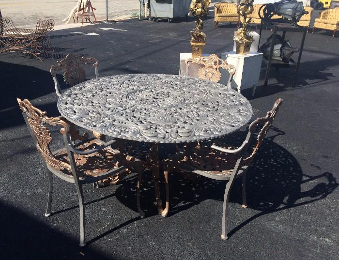 One of a set of two beautiful cast aluminum tables with ten chairs. Will divide