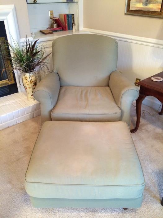 Comfy upholstered chair with matching ottoman.