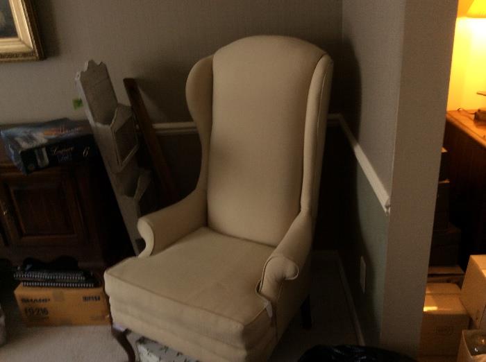One of two marching wing back chairs