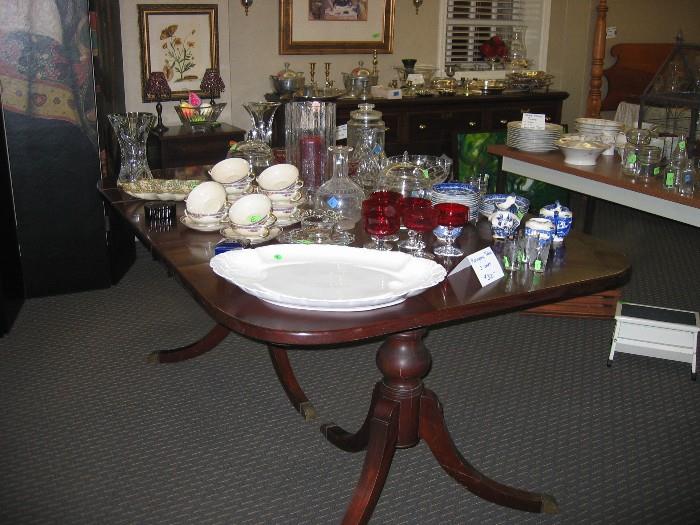 Mahogany table and lots of crystal and ceramic pieces.