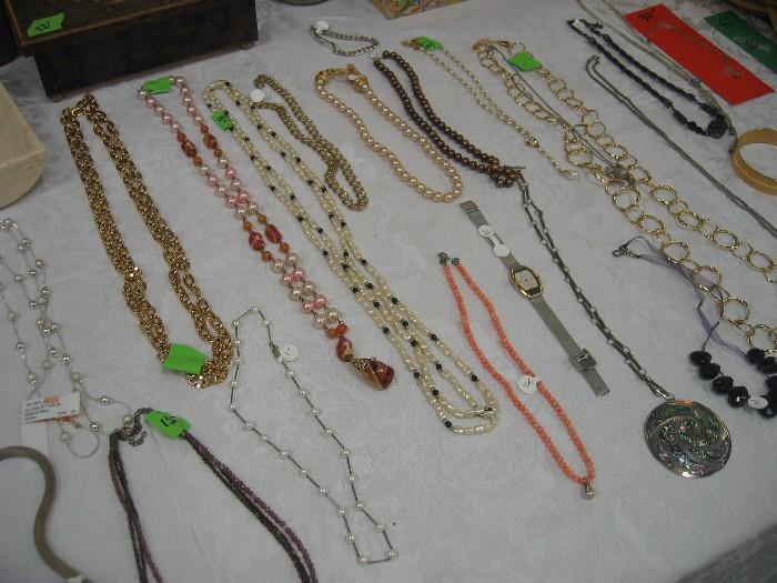 Lots of jewelry - some sterling silver, coral, and lots of costume pieces.