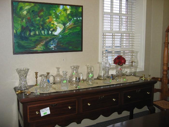 Henkel Harris sideboard with glass pitchers, decanters and carafes. 