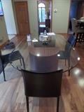 OBLONG BEVELED GLASS TABLE WITH 2 PC BASE, AND 4 LEATHER DINING CHAIRS