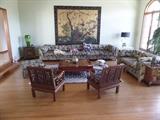 LONG SHOT OF THE LIVING ROOM.  VERSATILE UPHOLSTERED SECTIONAL & LOVE SEAT. GREAT FOR FAMILY ROOM. 6 PANEL PAINTED SCREEN