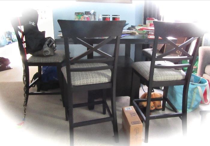48" bar height table with drop leaves.  Includes 4 chairs and 4 stools